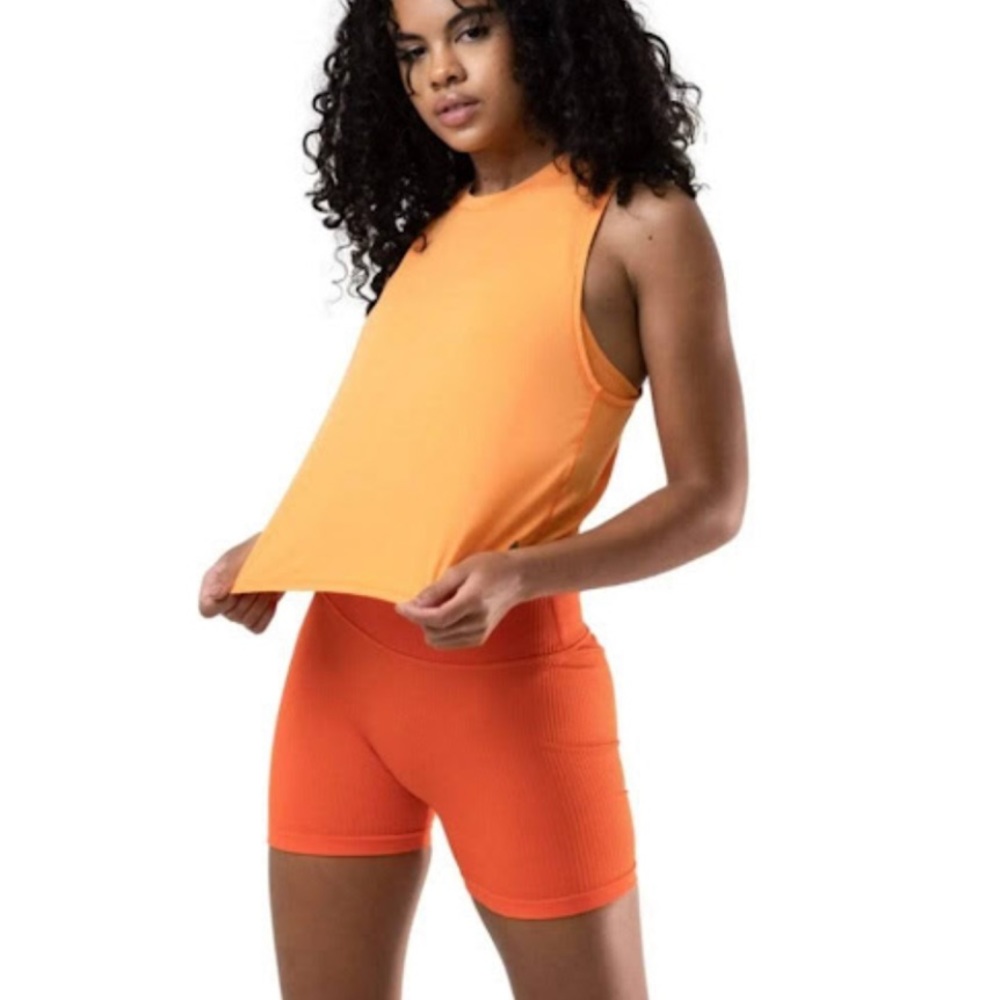Balance Athletica harmony tank top. Orange. Size medium. Never worn.